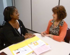 Deb with Red Cross staffer, during a speed coaching demo for International Coaching Weeks, 2014
